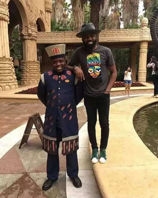 Noble Igwe Spotted in South Africa Rocking Contemporary Printed T-Shirt by Nigeria Label "James Johnson Clothing"